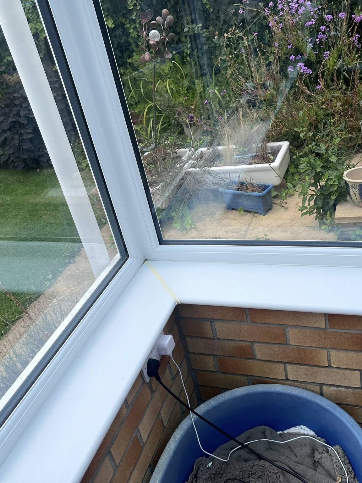 A very clean white corner of a conservatory